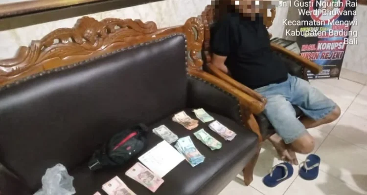 Uang palsu, Pasar Mengwi, Badung, Polres Badung, Polsek Mengwi, pria 53 tahun, uang diduga palsu, pecahan Rp100 ribu, 98 lembar uang, belanja pasar, Desa Beraban, Tabanan, kriminal, kasus uang palsu.